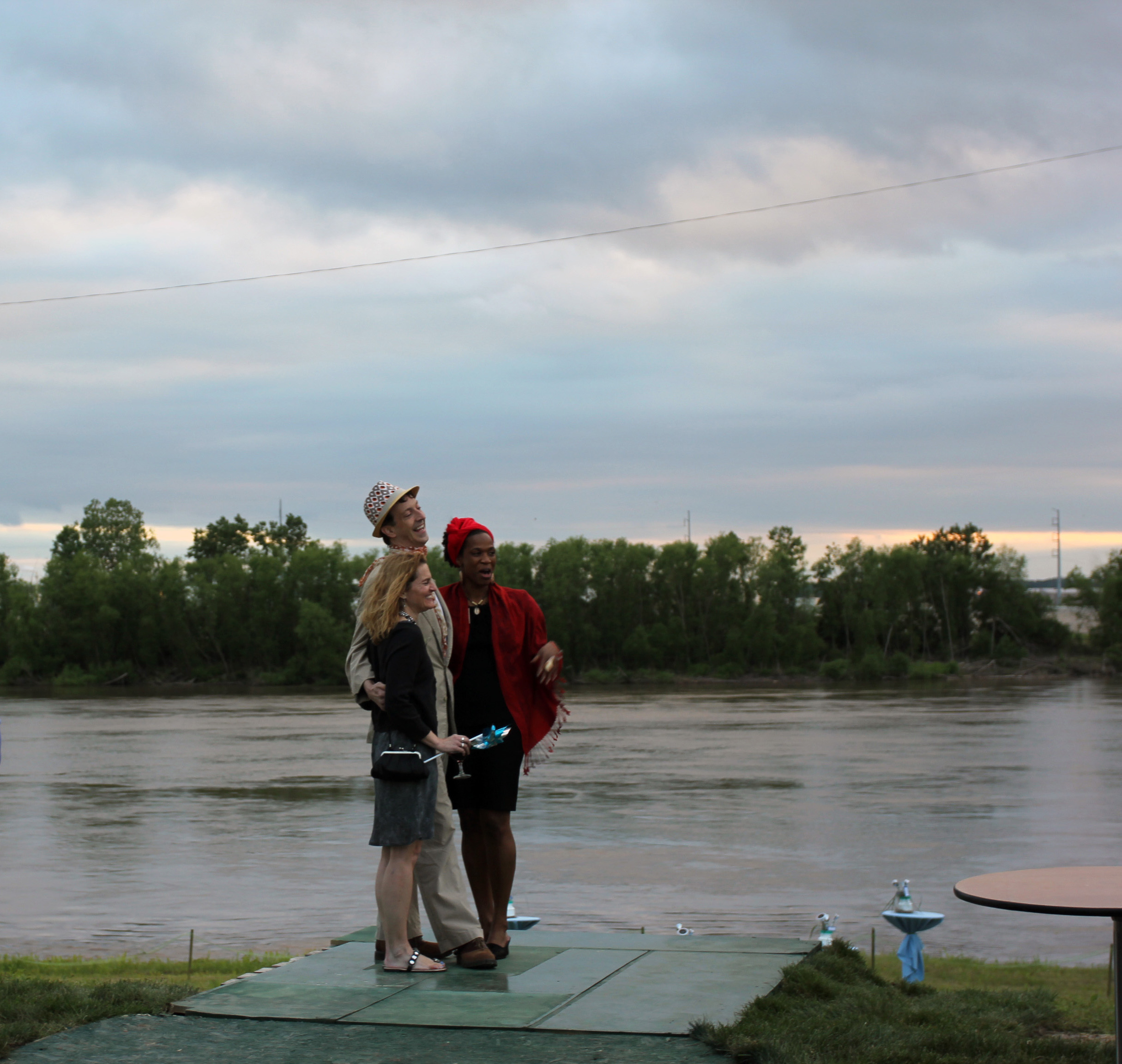 Guests at Bridging the Gap's Party at the Pumphouse get their photo taken in front of a Missouri River vista.