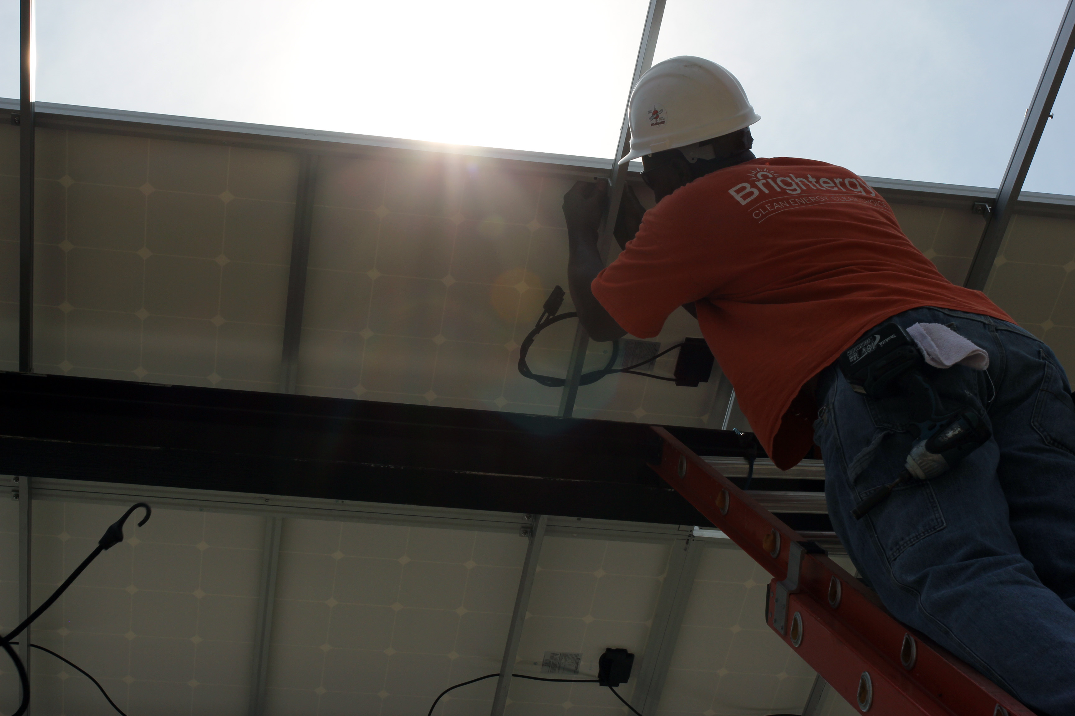 Solar Installer Terry Seals at work on a solar installation at Spencer Parsons in the West Bottoms of Kansas City. 