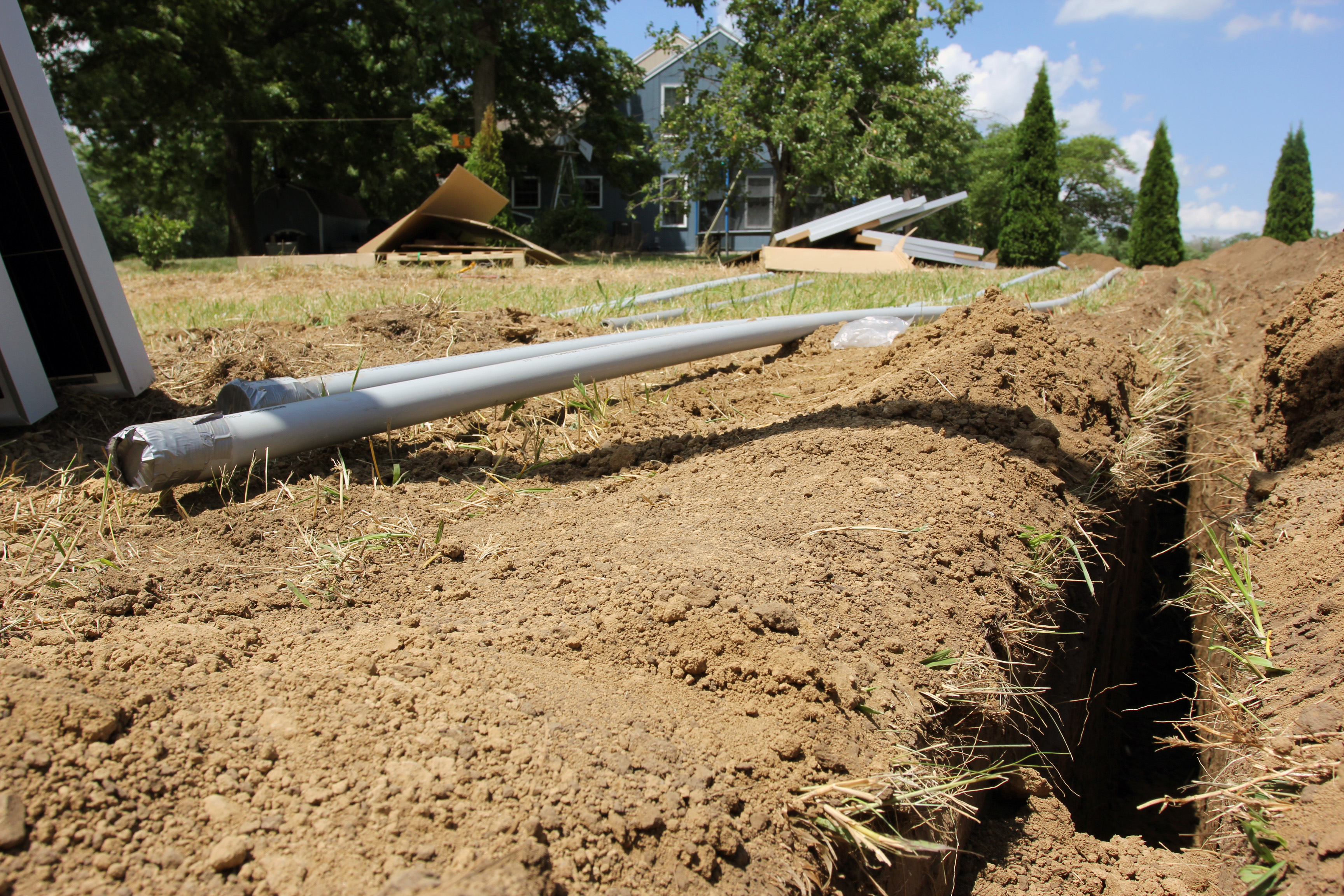 In the solar trenches: a deep trench must be dug to house electrical conduit for the Browns' solar array.