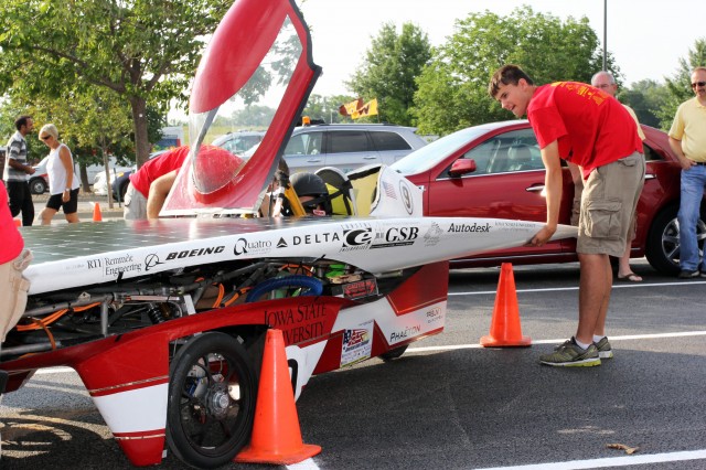 ISU Team members getting solar-powered car Phaeton ready for the starting line
