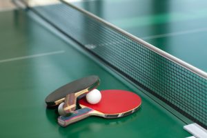 shutterstock stock image of ping pong paddles and ball on table